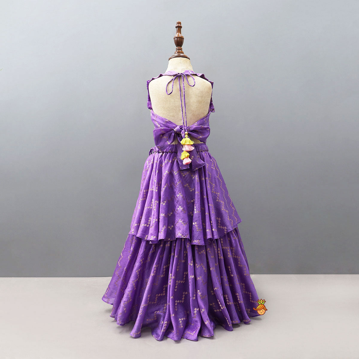Trendy Open-Back Crop Top And Layered Lehenga