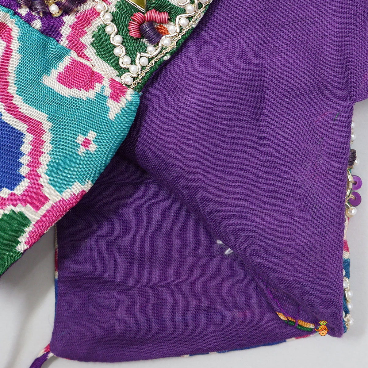 Heavily Embroidered Colourful Top And Lehenga With Potli Bag