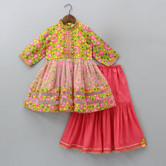 Pre Order: Floral Printed Multicolour Net Bottom Kurti And Coral Pink Sharara With Gota Lace Detail Dupatta