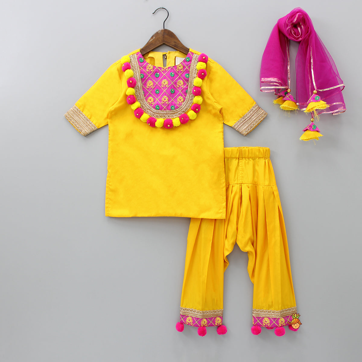 Pre Order: Pom Pom Enhanced Yellow Kurti And Salwar With Contrasting Pink Dupatta