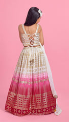 Pre Order: Sequined Off White Top And Two Tone Lehenga With Dupatta And Matching Potli Bag With Bowie Hair Clip
