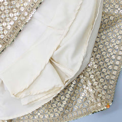 Pre Order: Charming Beige Organza Puffed Sleeves Sequined Top And Lehenga With Matching Dupatta