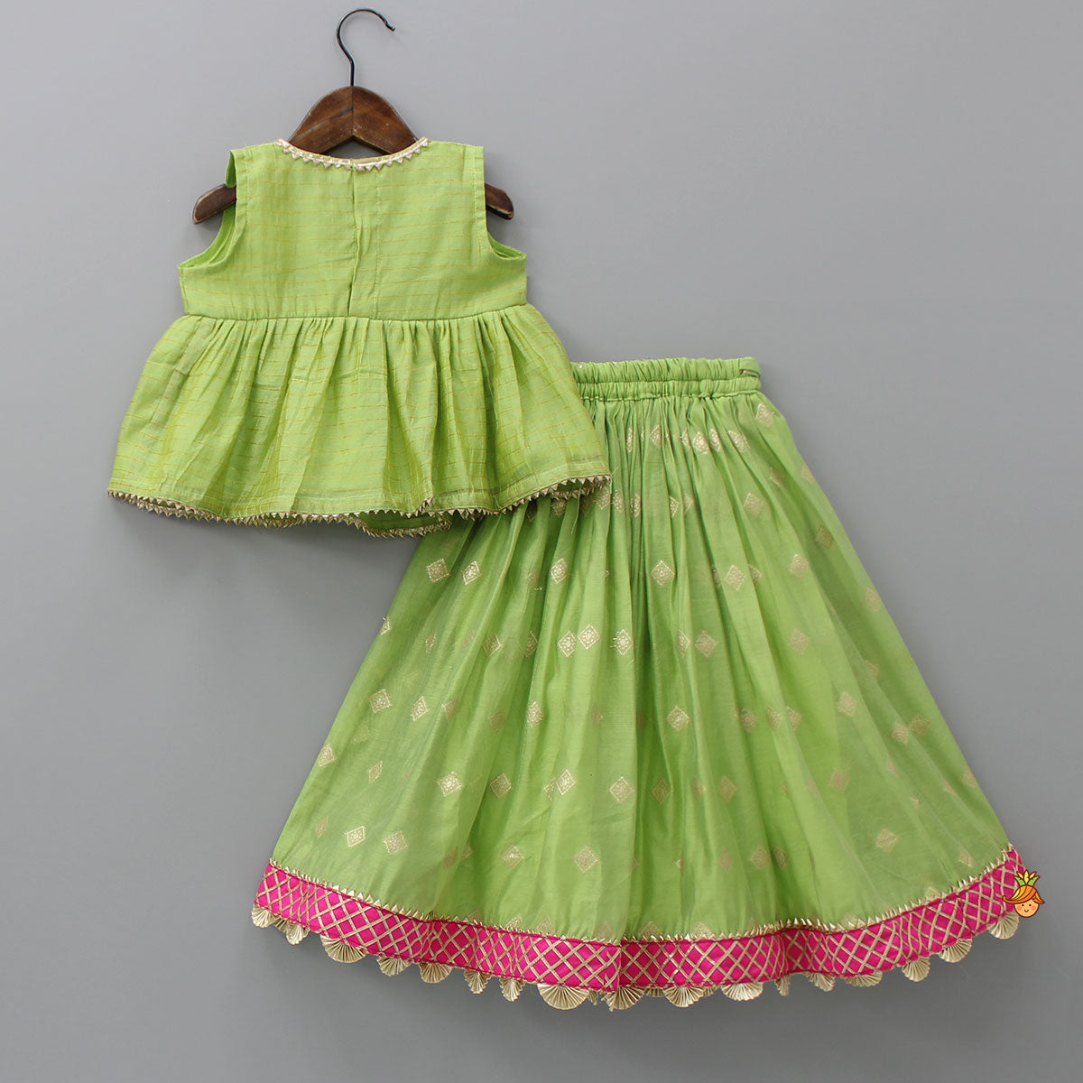 Contrasting Potli Buttons Detail Leaf Green Top And Gota Tassels Enhanced Lehenga