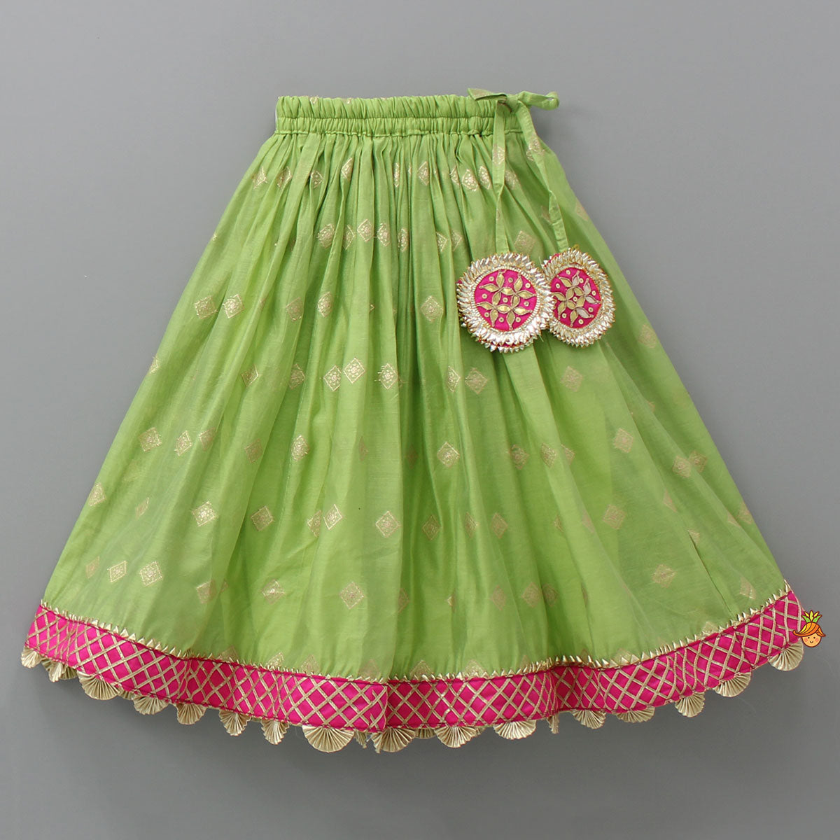 Contrasting Potli Buttons Detail Leaf Green Top And Gota Tassels Enhanced Lehenga