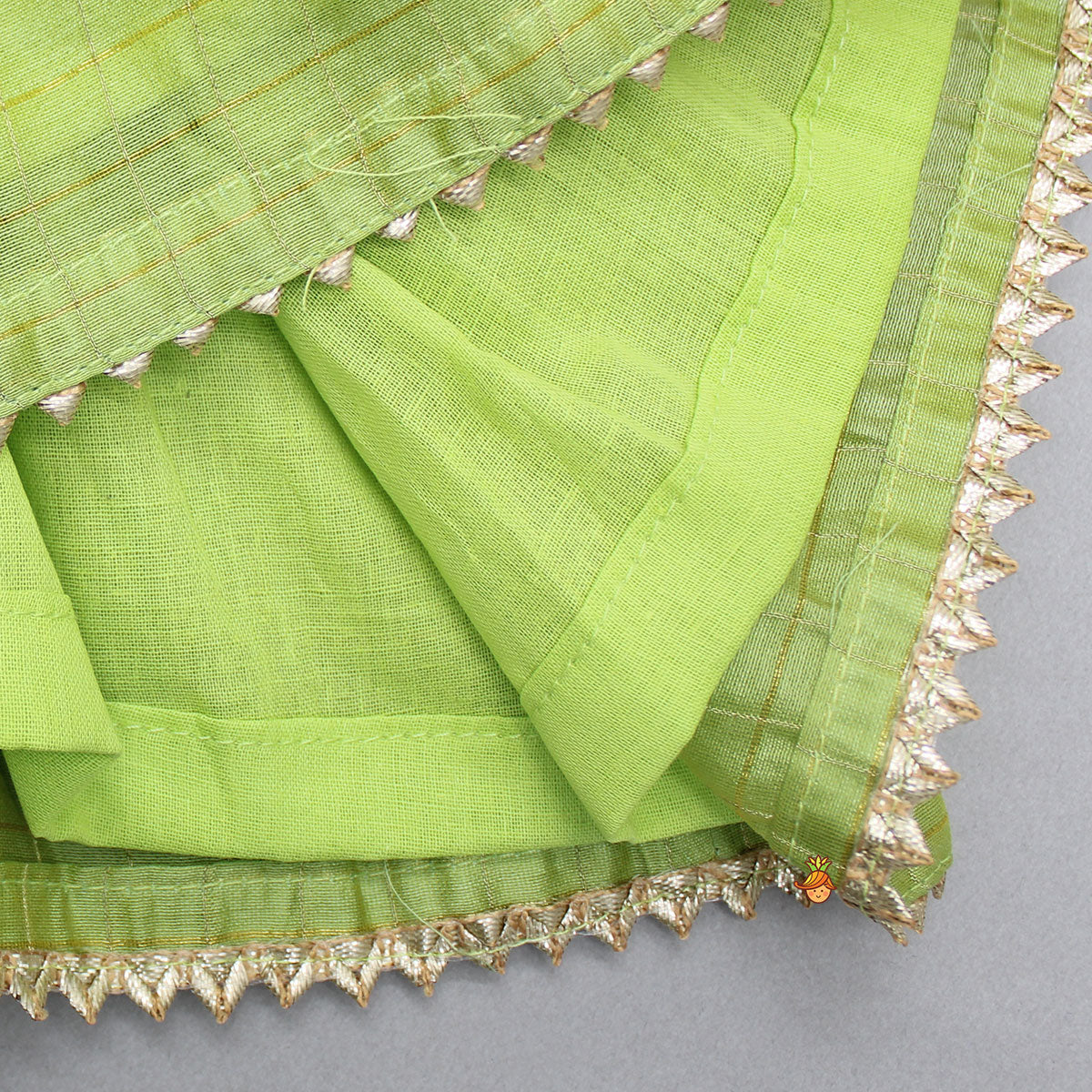 Contrasting Potli Buttons Detail Leaf Green Top And Gota Tassels Enhanced Lehenga