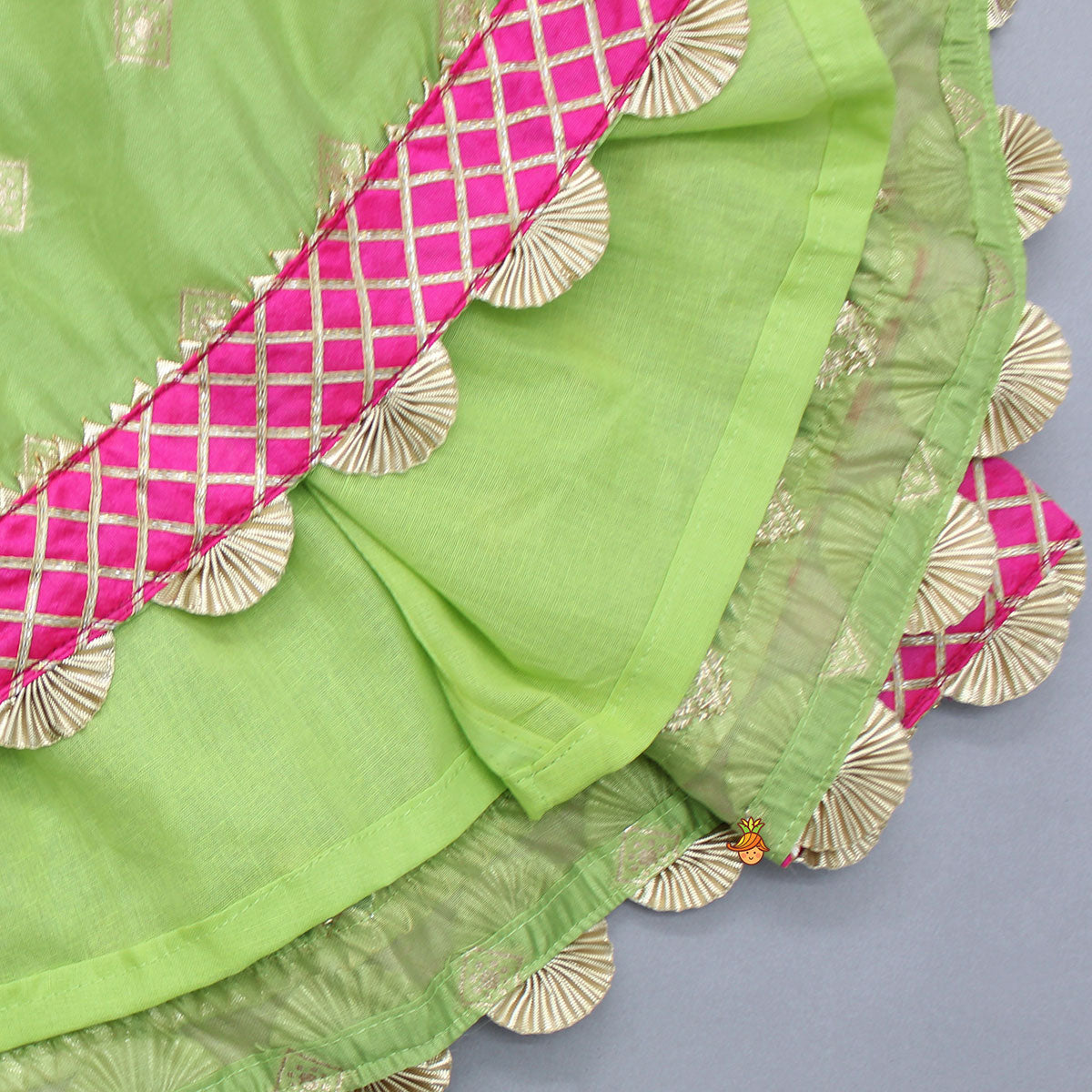 Contrasting Potli Buttons Detail Leaf Green Top And Gota Tassels Enhanced Lehenga