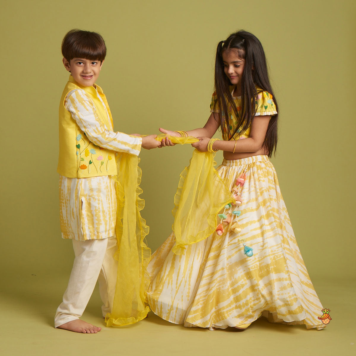 Beaded Yellow Top And Shibori Printed Lehenga With Ruffle Dupatta twinning model image 1