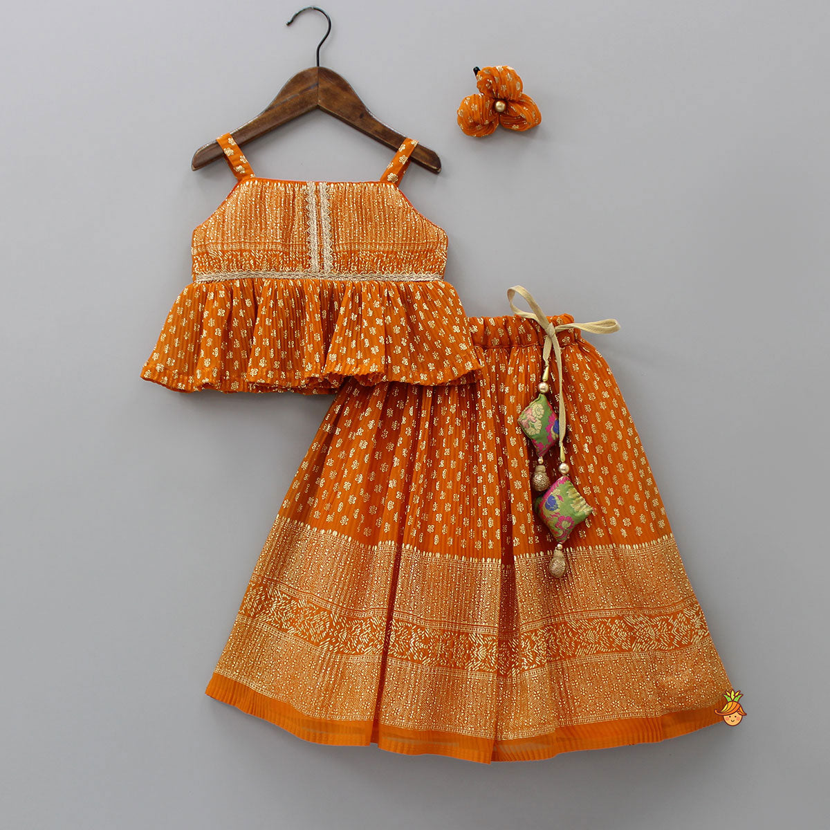 Rust Orange Pleated Georgette Top And Lehenga With Hair Clip