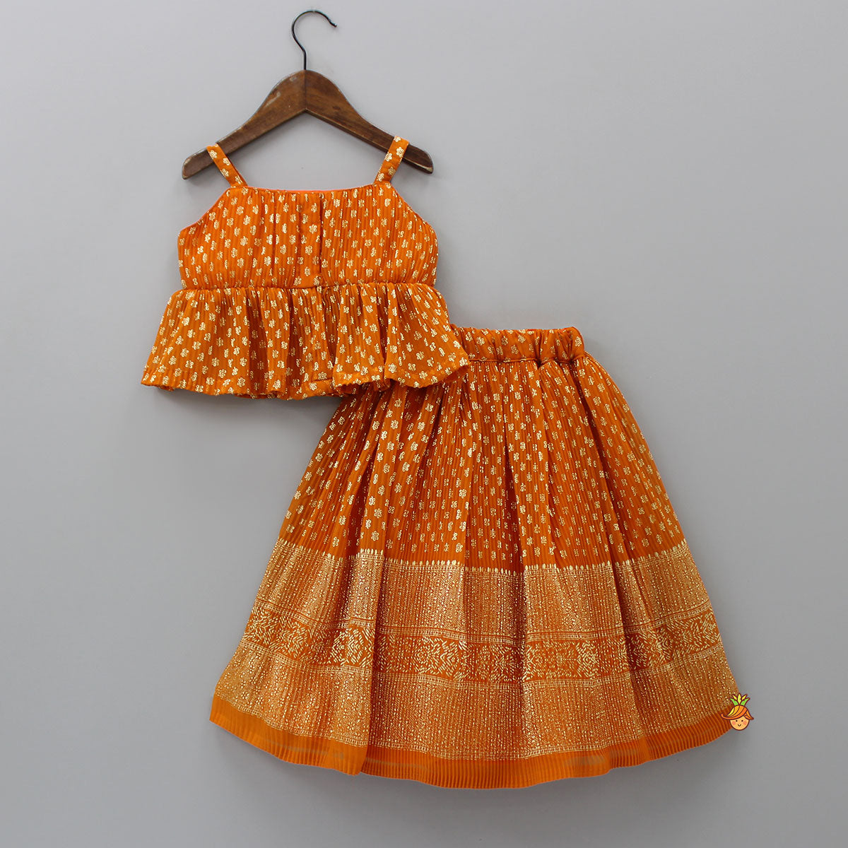 Rust Orange Pleated Georgette Top And Lehenga With Hair Clip