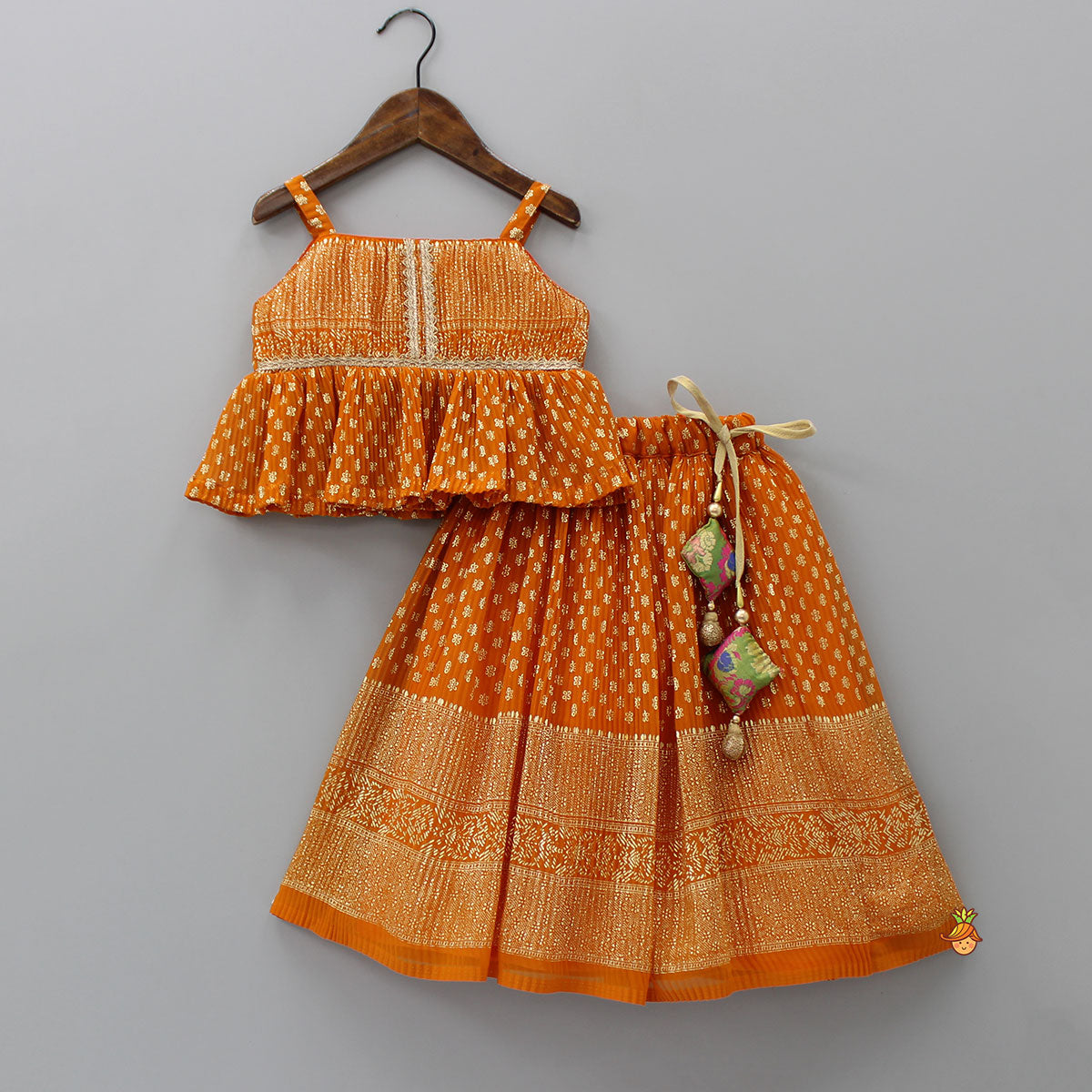 Rust Orange Pleated Georgette Top And Lehenga With Hair Clip