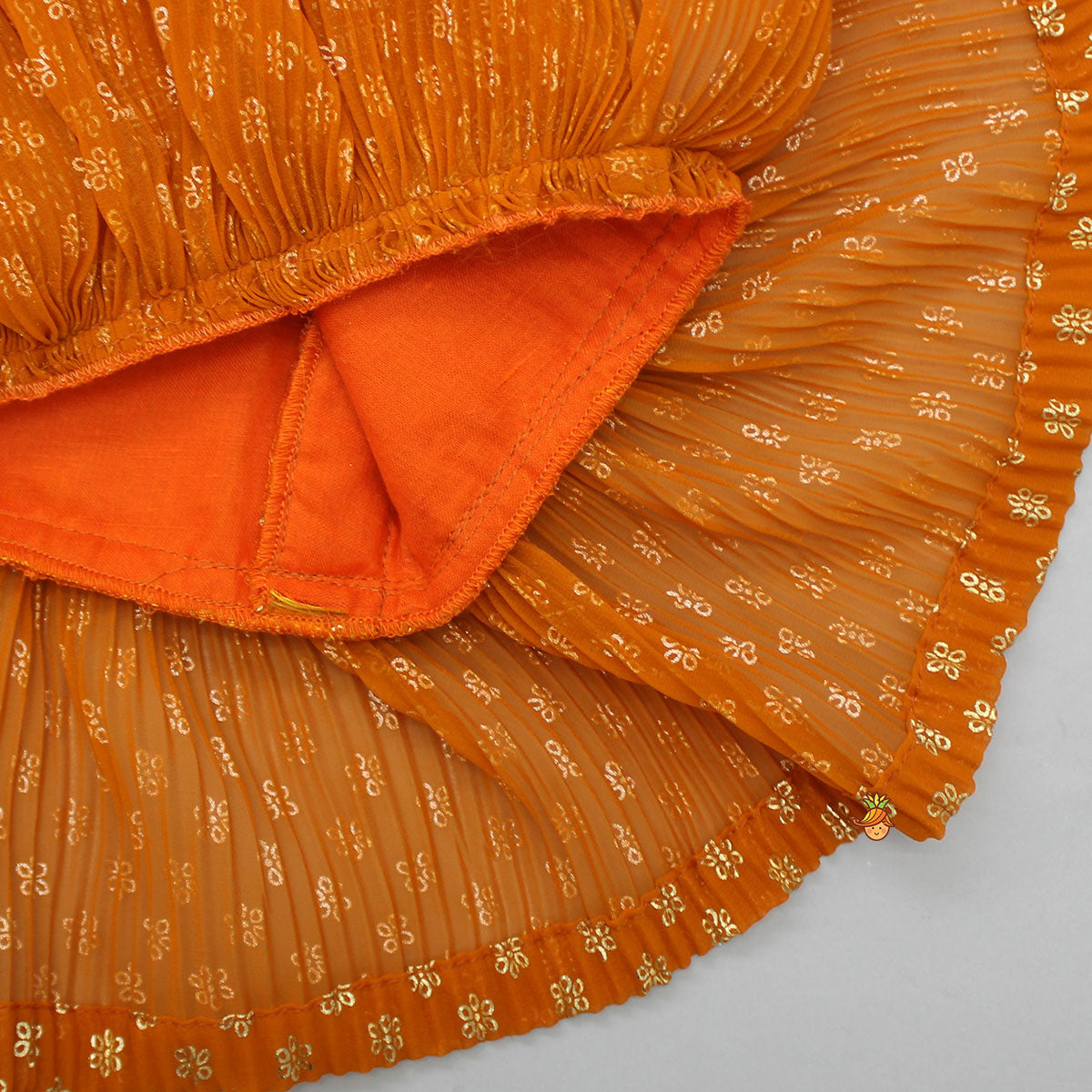 Rust Orange Pleated Georgette Top And Lehenga With Hair Clip