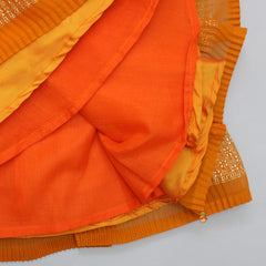 Pre Order: Rust Orange Pleated Georgette Top And Lehenga With Hair Clip