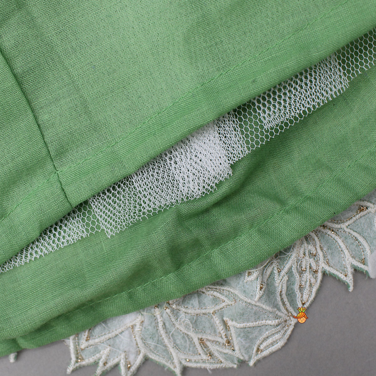 Pleated Neckline Green Shimmery Top And Fringes Tassels Enhanced Lehenga