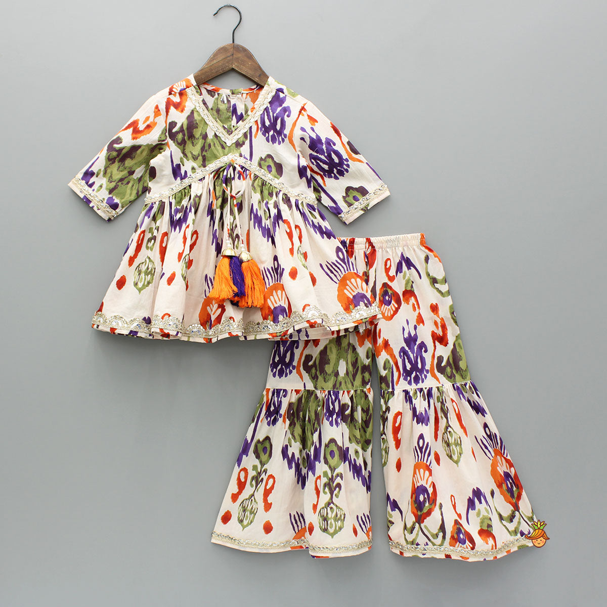 Tassels Enhanced Multicolour Printed Kurti And Sharara With Scalloped Lace Detail Dupatta
