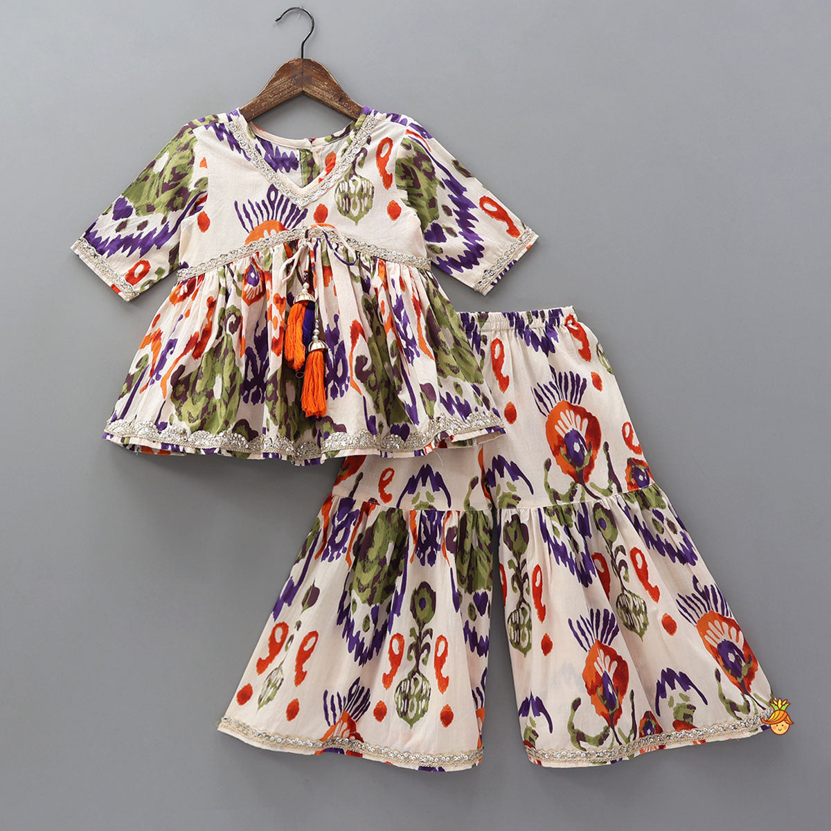Tassels Enhanced Multicolour Printed Kurti And Sharara With Scalloped Lace Detail Dupatta