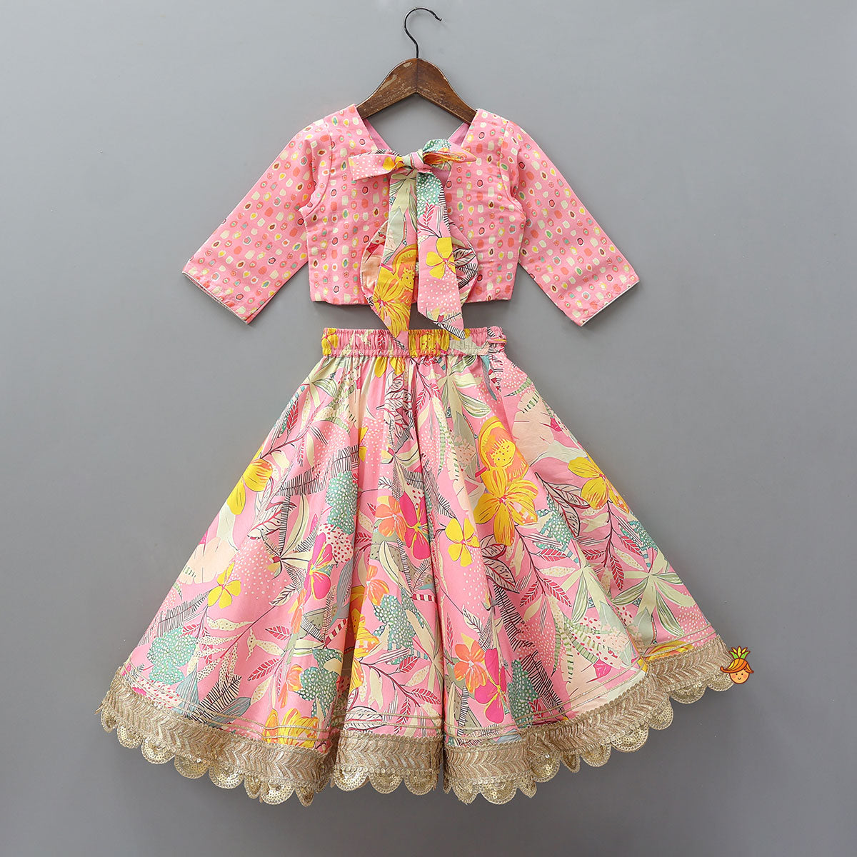 Buttons Adorned Pink Top And Scalloped Lace Work Floral Lehenga