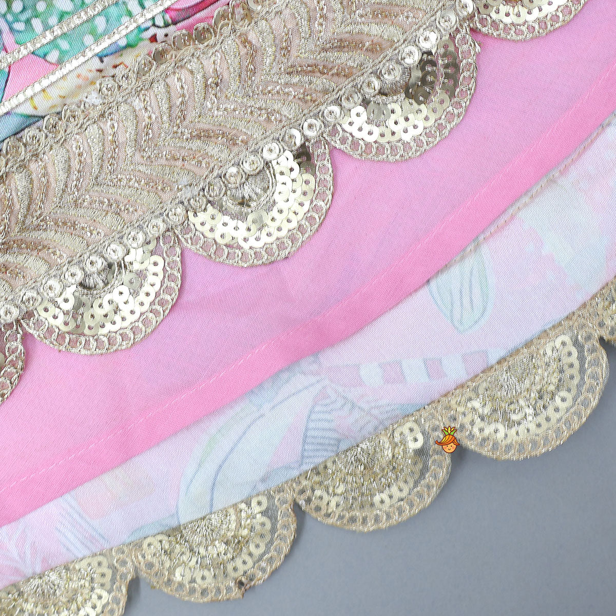 Buttons Adorned Pink Top And Scalloped Lace Work Floral Lehenga