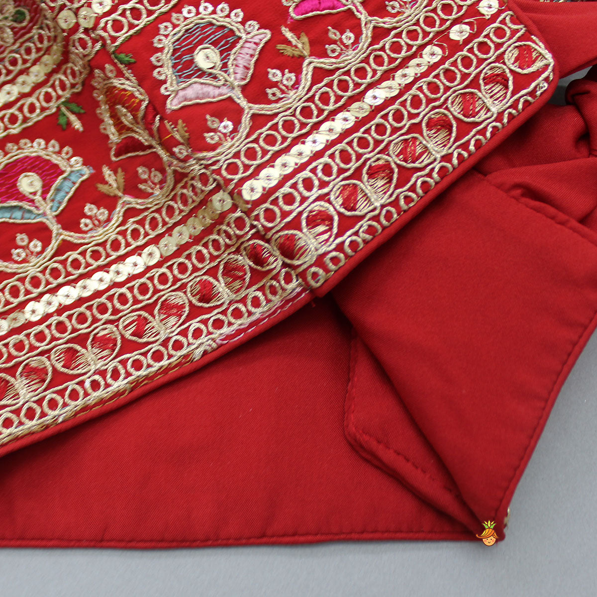 Back Knot Detail Beautiful Red Top And Lehenga With Matching Net Dupatta