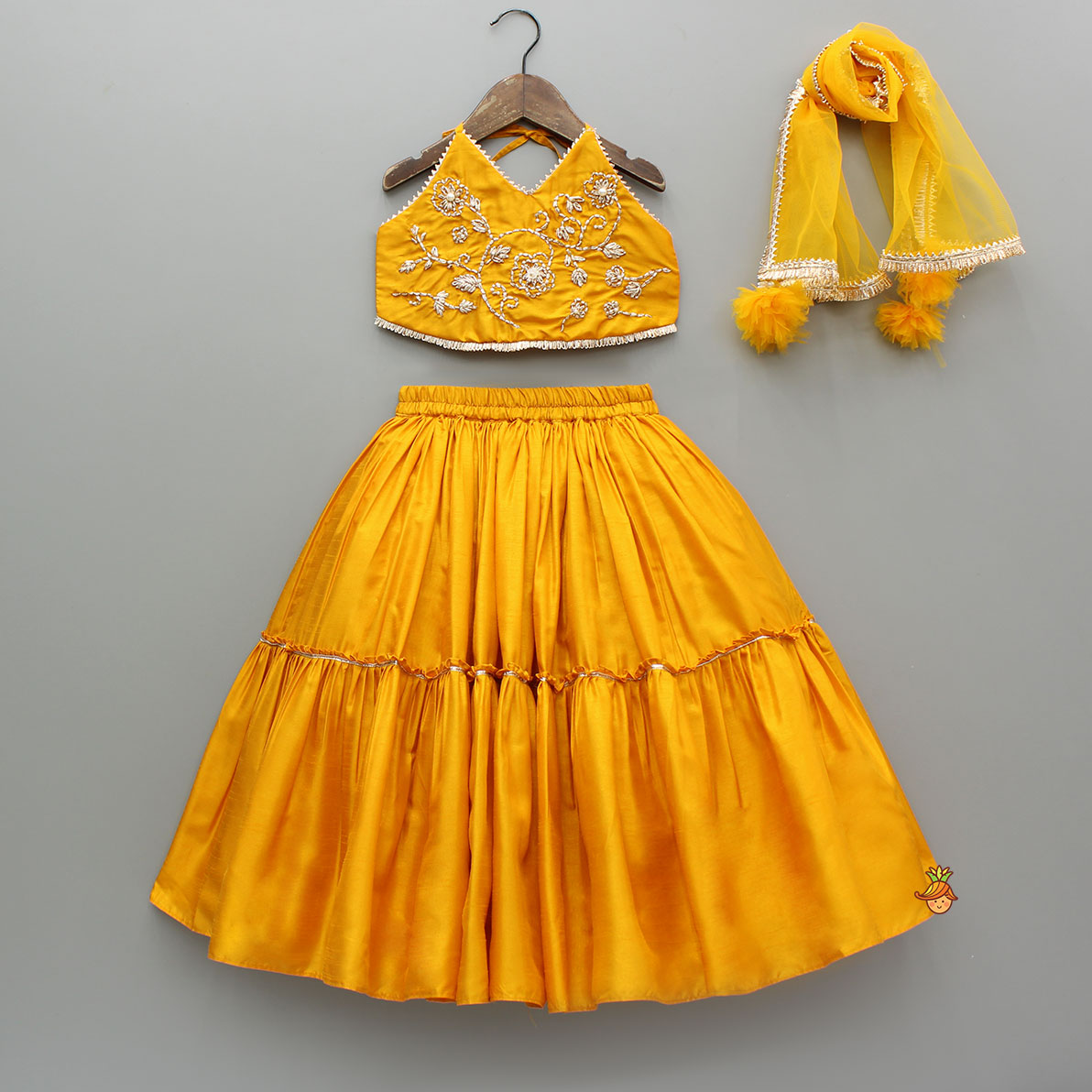 Beautiful Halter Neck Embroidered Mustard Top And Lehenga With Net Dupatta