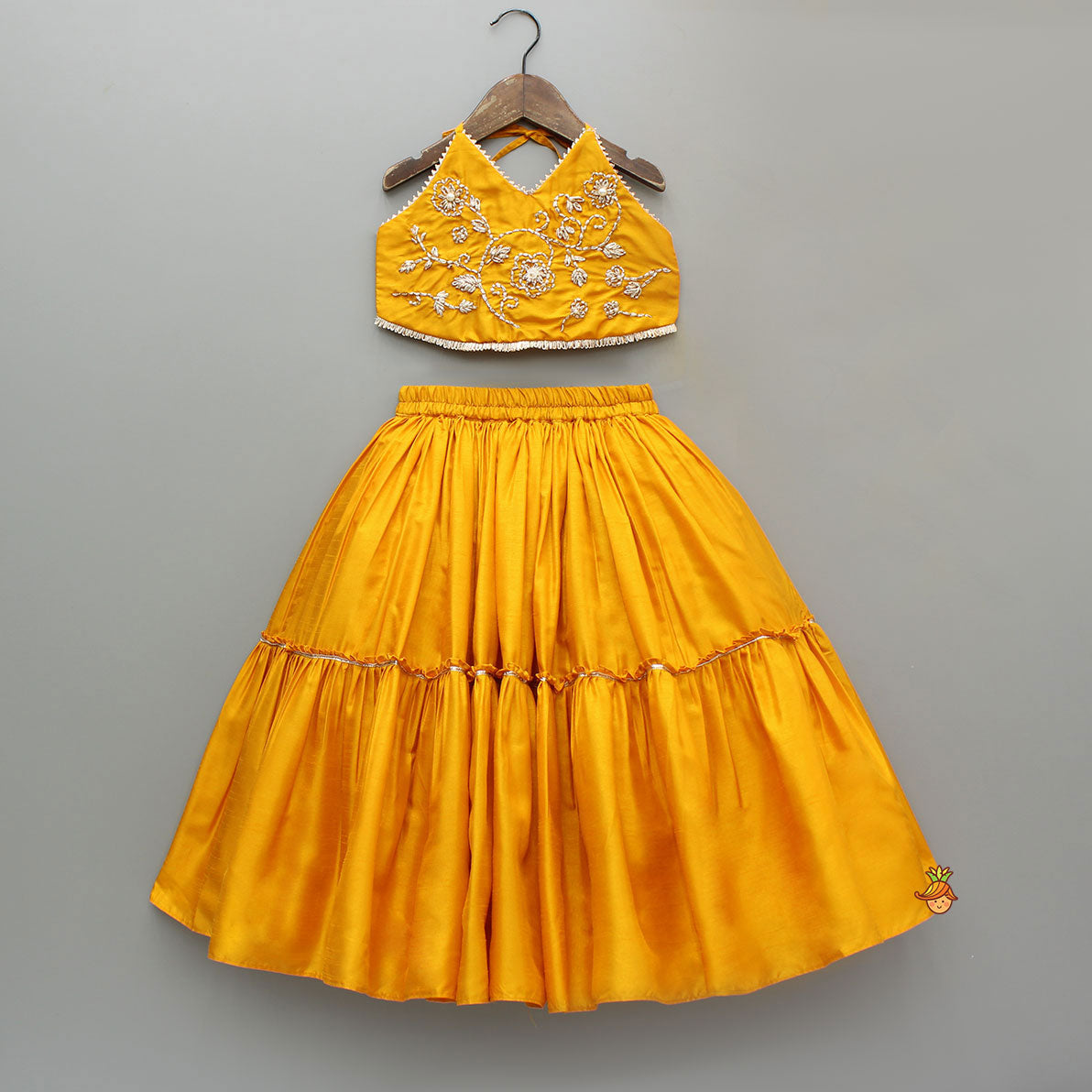 Beautiful Halter Neck Embroidered Mustard Top And Lehenga With Net Dupatta