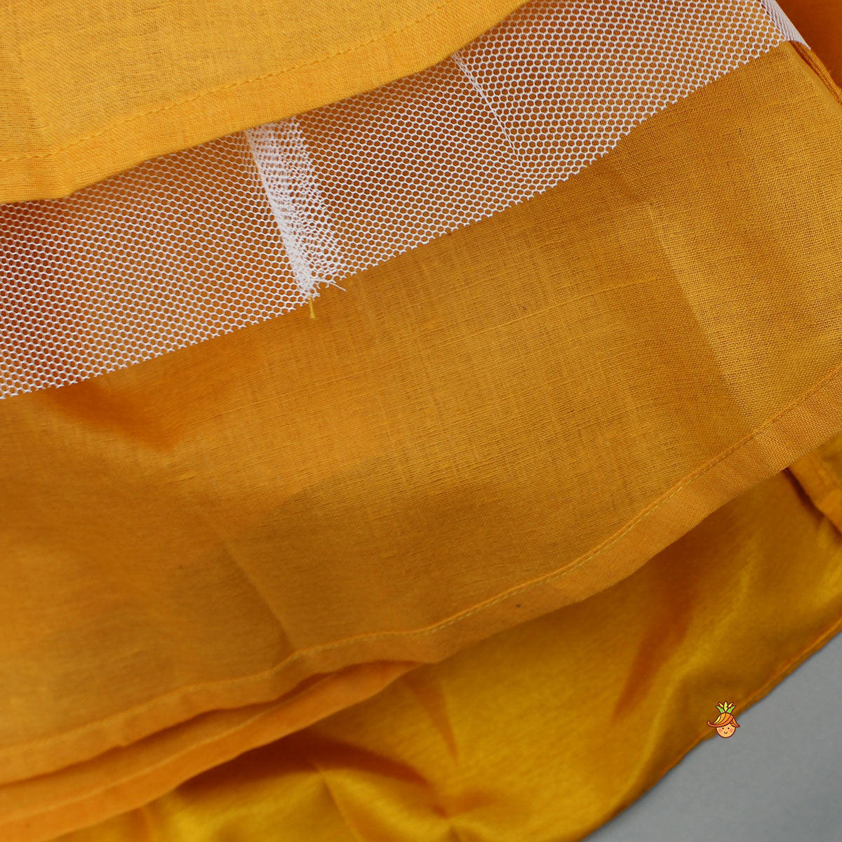 Beautiful Halter Neck Embroidered Mustard Top And Lehenga With Net Dupatta