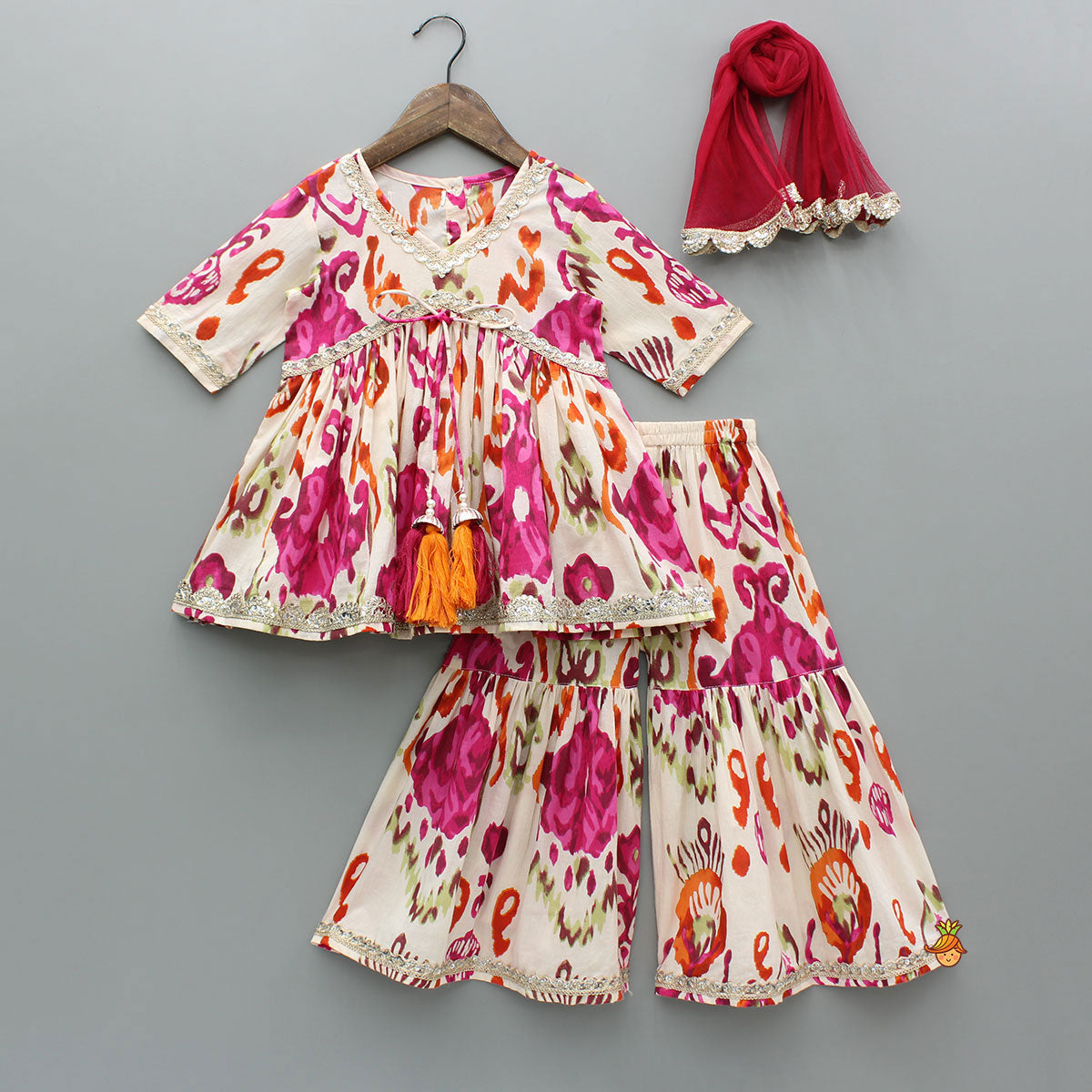 Tassels Enhanced Multicolour Printed Kurti And Sharara With Scalloped Lace Detail Pink Dupatta