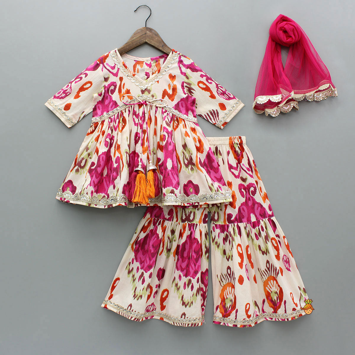 Tassels Enhanced Multicolour Printed Kurti And Sharara With Scalloped Lace Detail Pink Dupatta