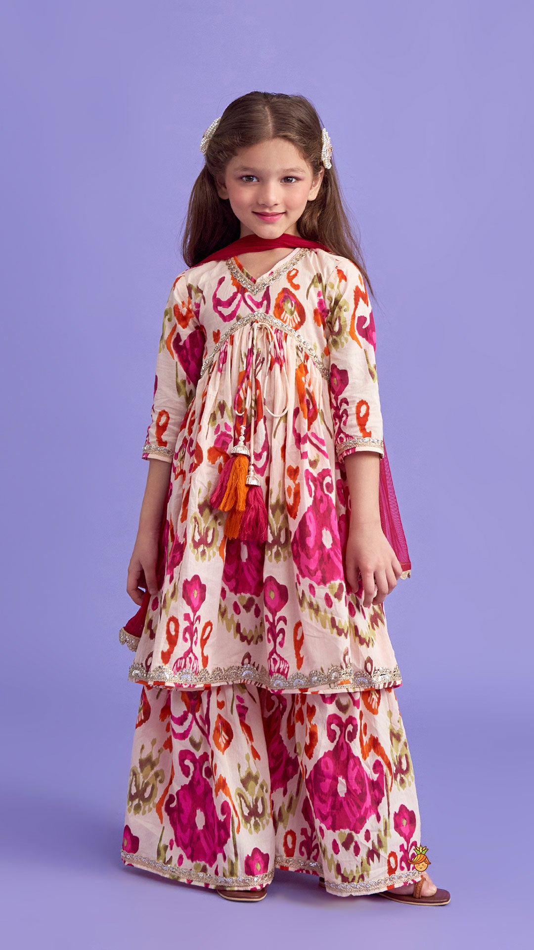 Tassels Enhanced Multicolour Printed Kurti And Sharara With Scalloped Lace Detail Pink Dupatta