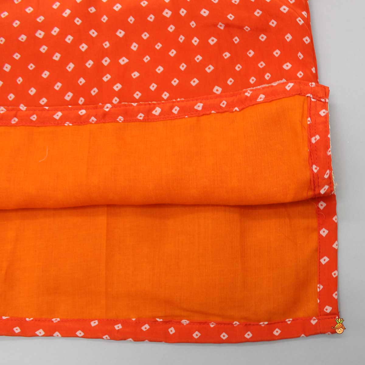 Orange Bandhani Printed Kurti And Tiered Sharara With Net Dupatta