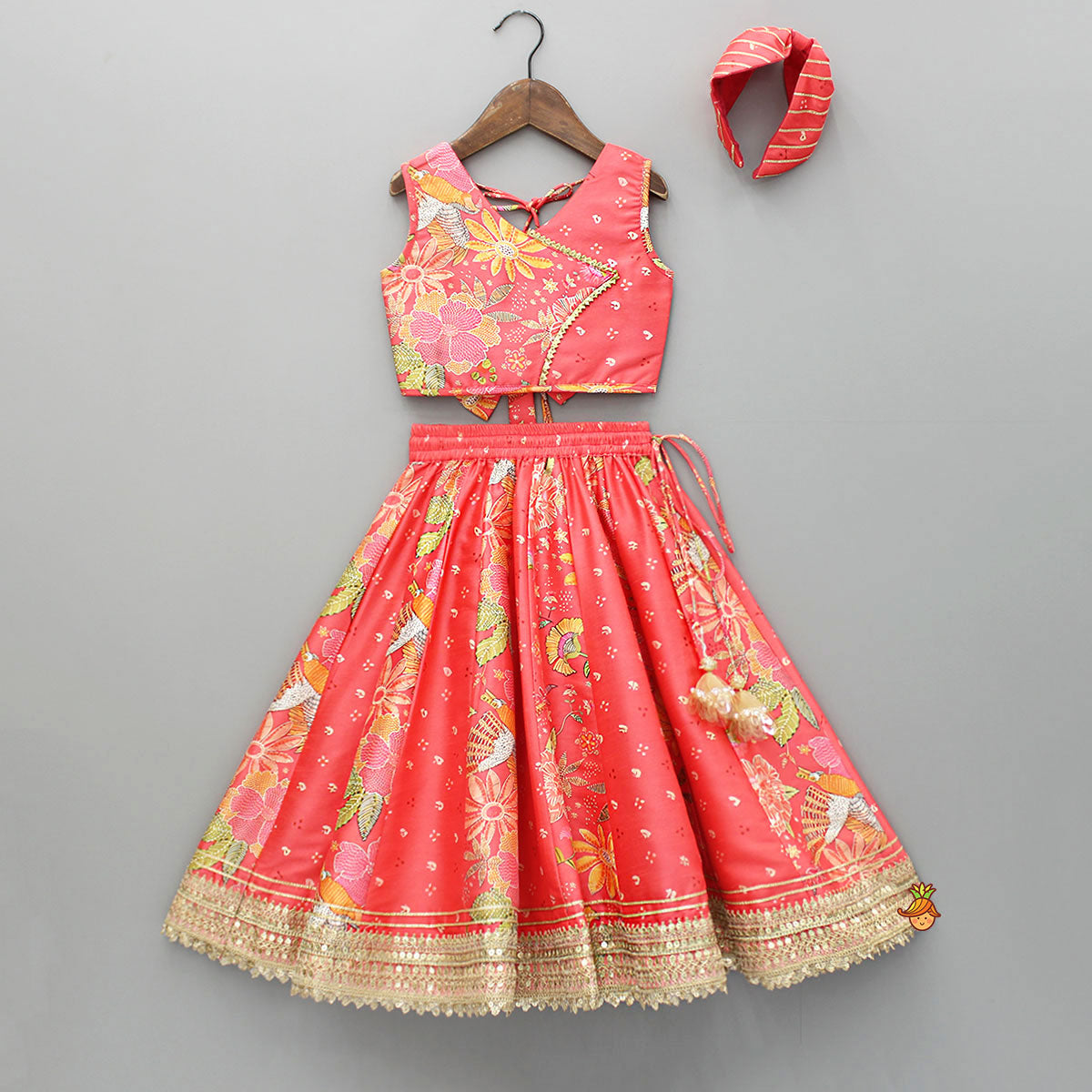 V Neck Peach Top And Printed Lehenga With Hair Band