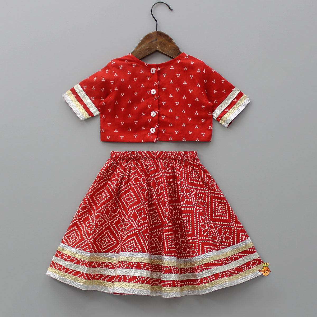 Bandhani Printed Red Top With Lehenga And Matching Booties With Head Band