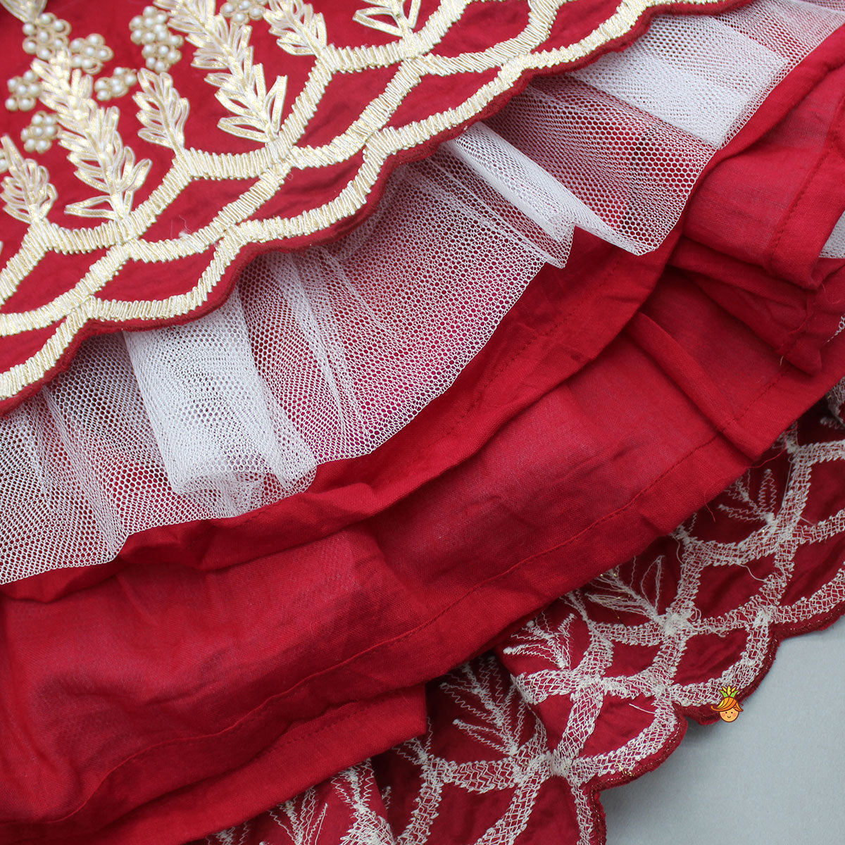 Embroidered Strappy Red Top And Pleated Lehenga