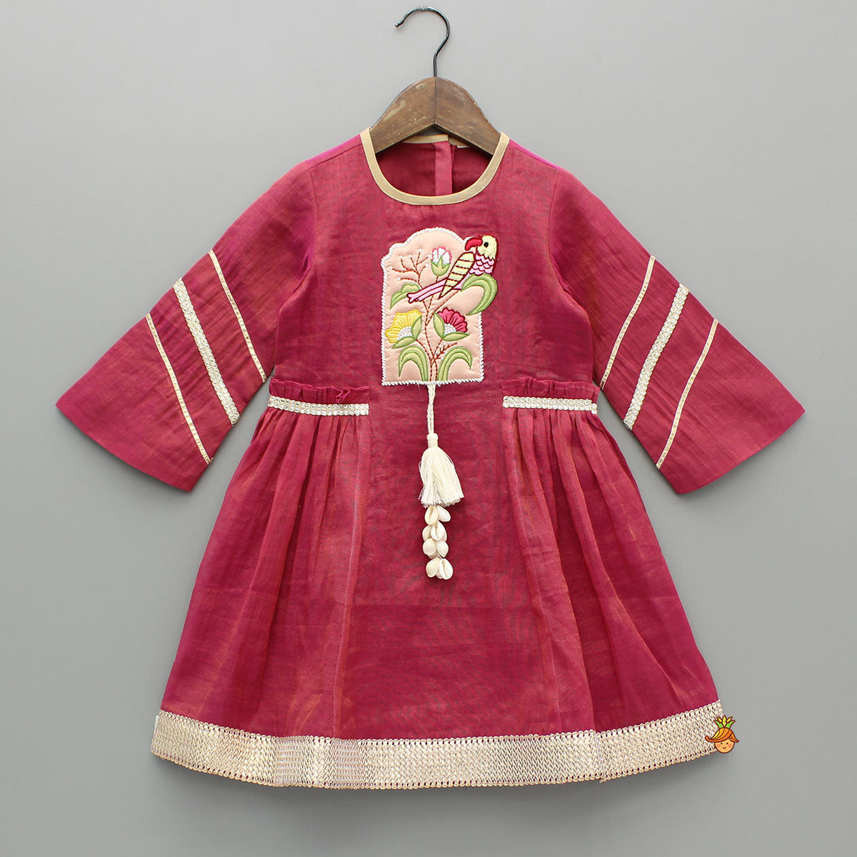 Tassel Adorned Shimmery Pink Embroidered Kurti With Pant