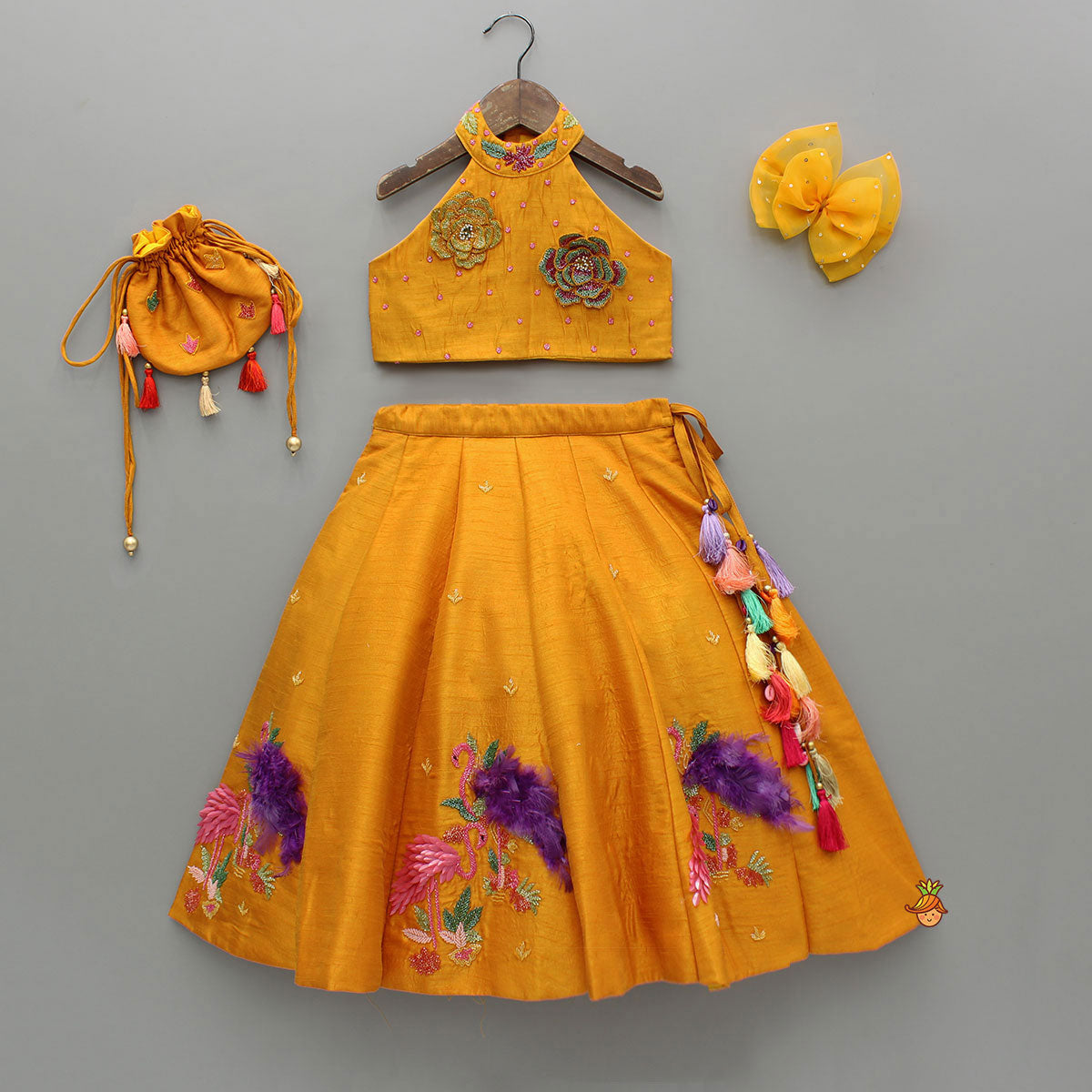 Floral Embroidered Halter Neck Top With Flared Lehenga And Bow Hair Clip With Potli Bag