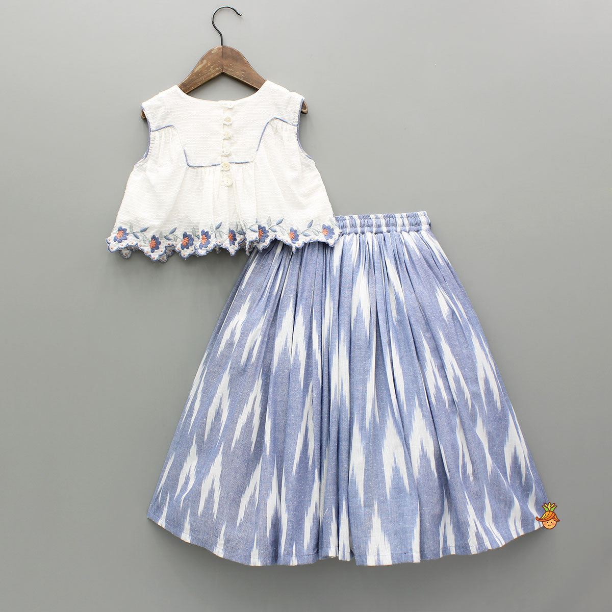 Cotton Top With Knot-Detailed Neckline And Ikat Printed Lehenga