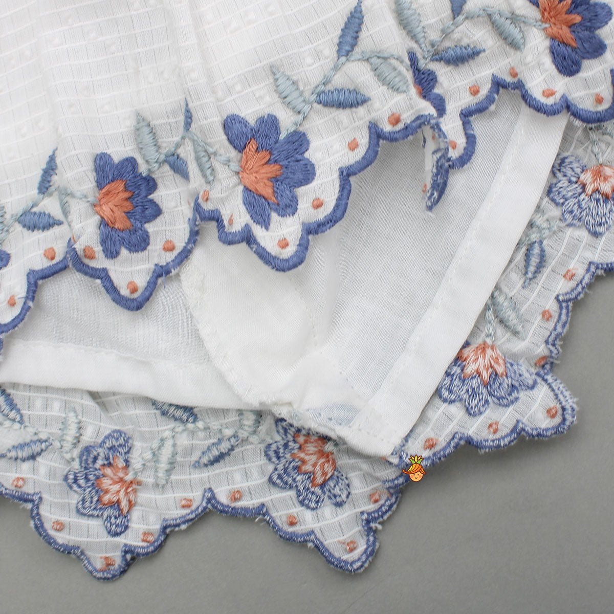 Cotton Top With Knot-Detailed Neckline And Ikat Printed Lehenga