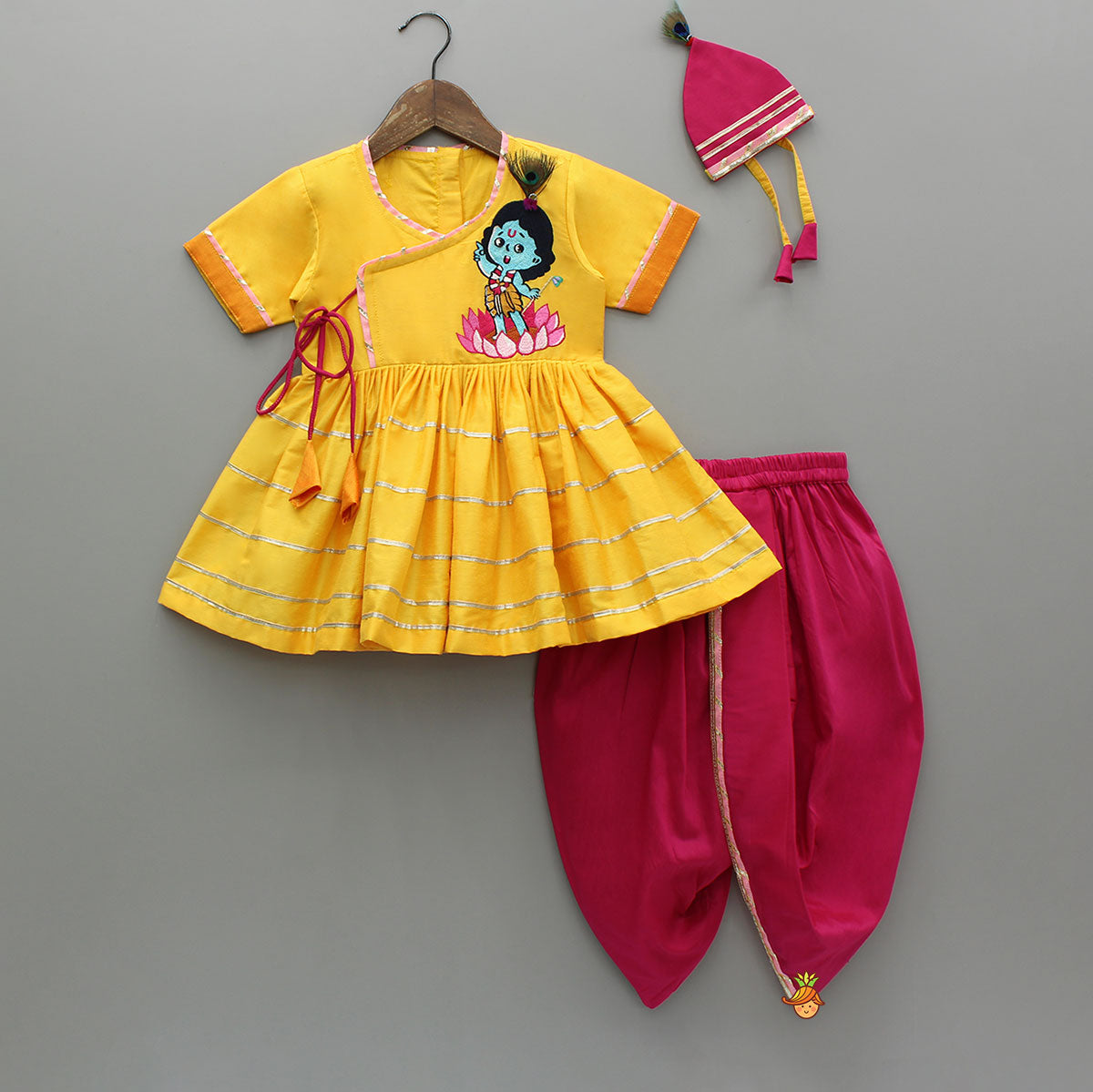 Krishna Embroidered Yellow Angarkha Top With Lace Work Pink Dhoti And Mukut