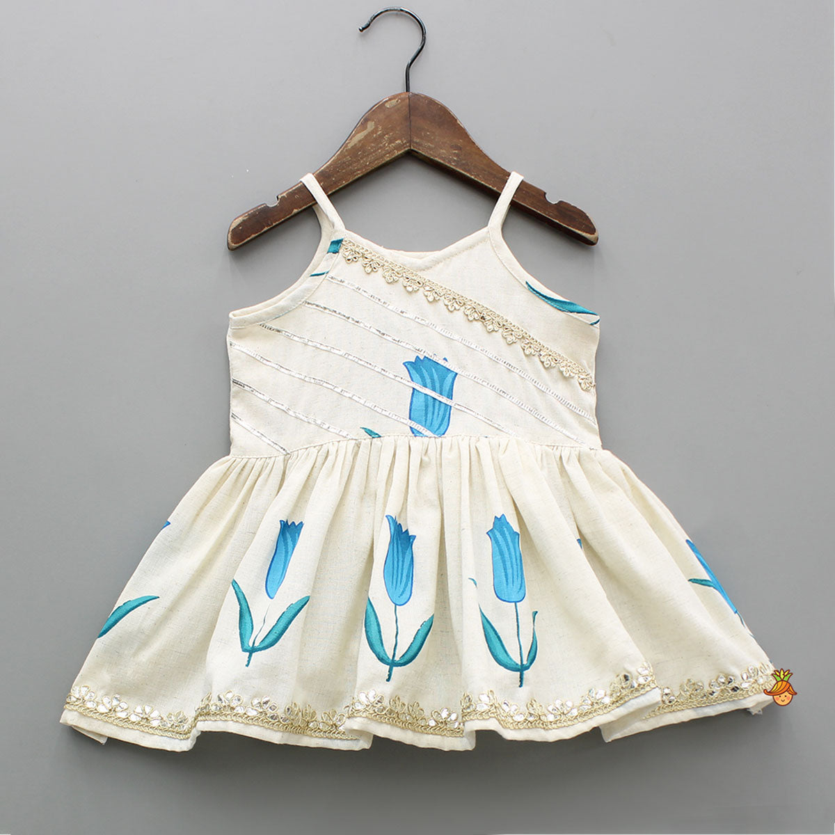 Tulip Printed Strappy Off White Kurti With Printed Sharara And Blue Dupatta