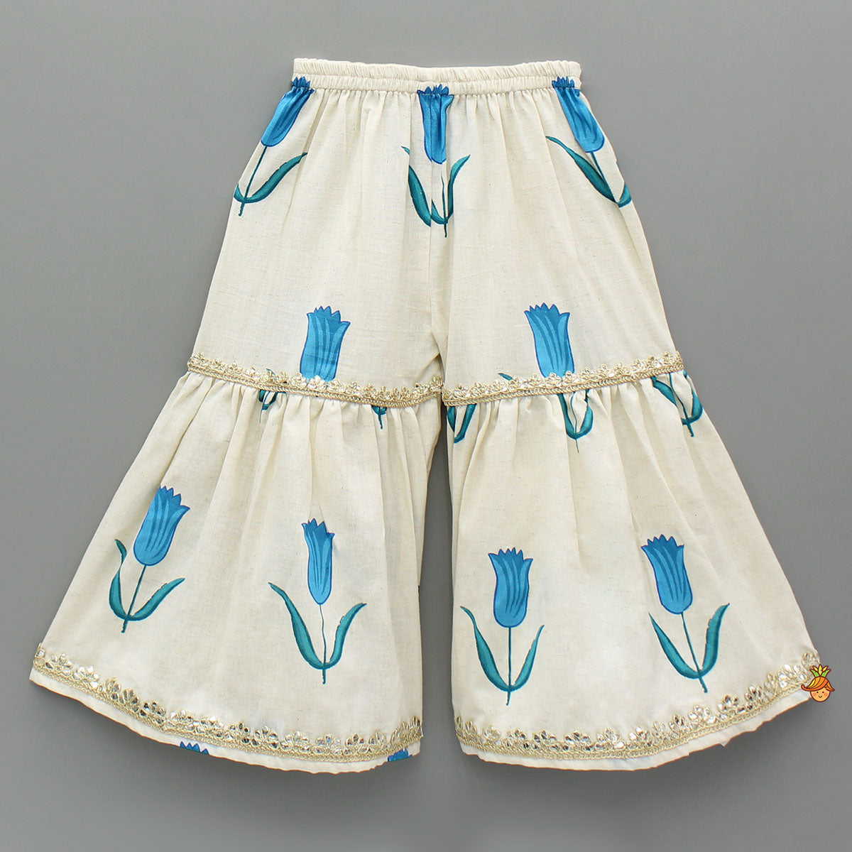 Tulip Printed Strappy Off White Kurti With Printed Sharara And Blue Dupatta