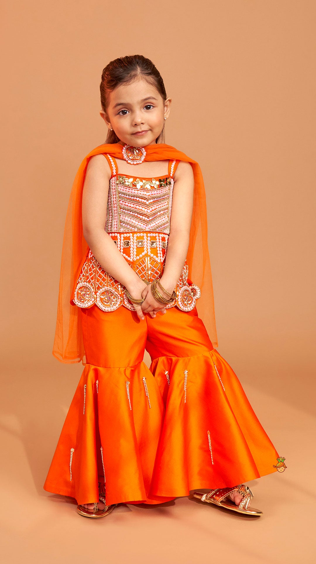 Exquisite Orange Kurti With Flared Sharara And Choker Dupatta
