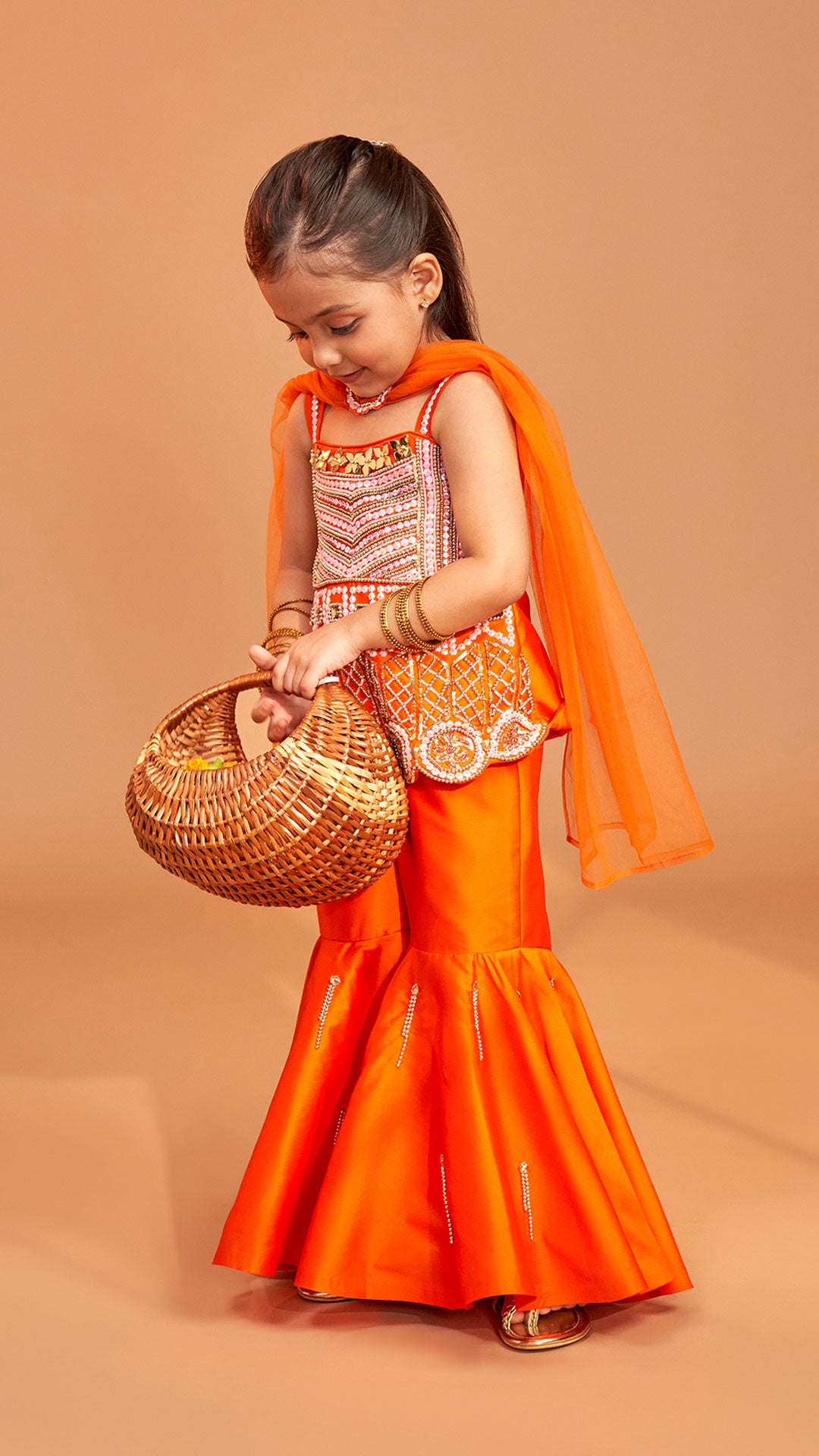 Exquisite Orange Kurti With Flared Sharara And Choker Dupatta