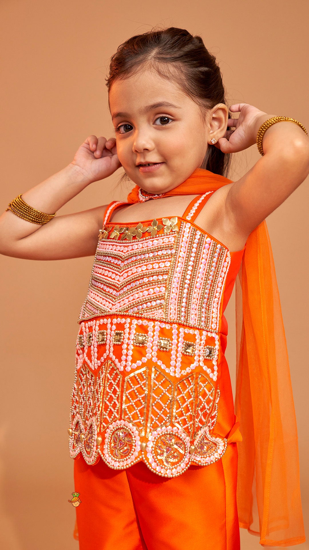 Exquisite Orange Kurti With Flared Sharara And Choker Dupatta