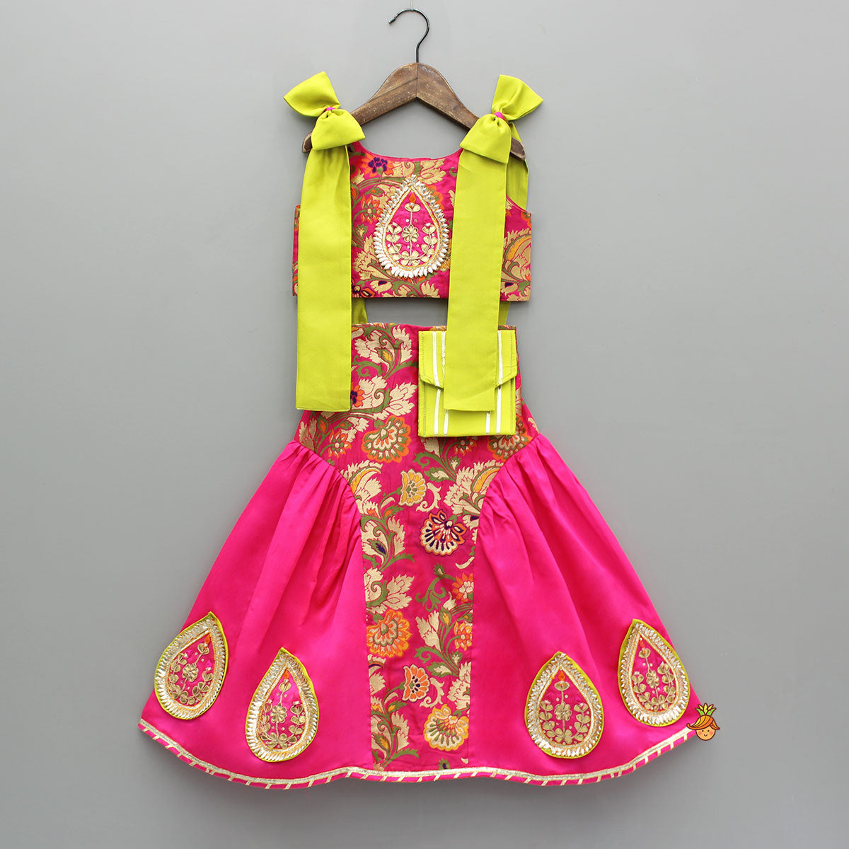 Stunning Bow Embellished Floral Top With Matching Lehenga And Attached Pouch