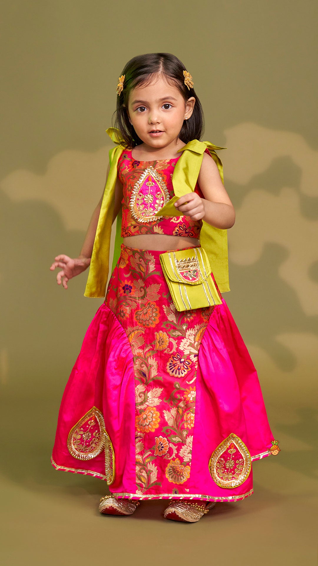 Stunning Bow Embellished Floral Top With Matching Lehenga And Attached Pouch
