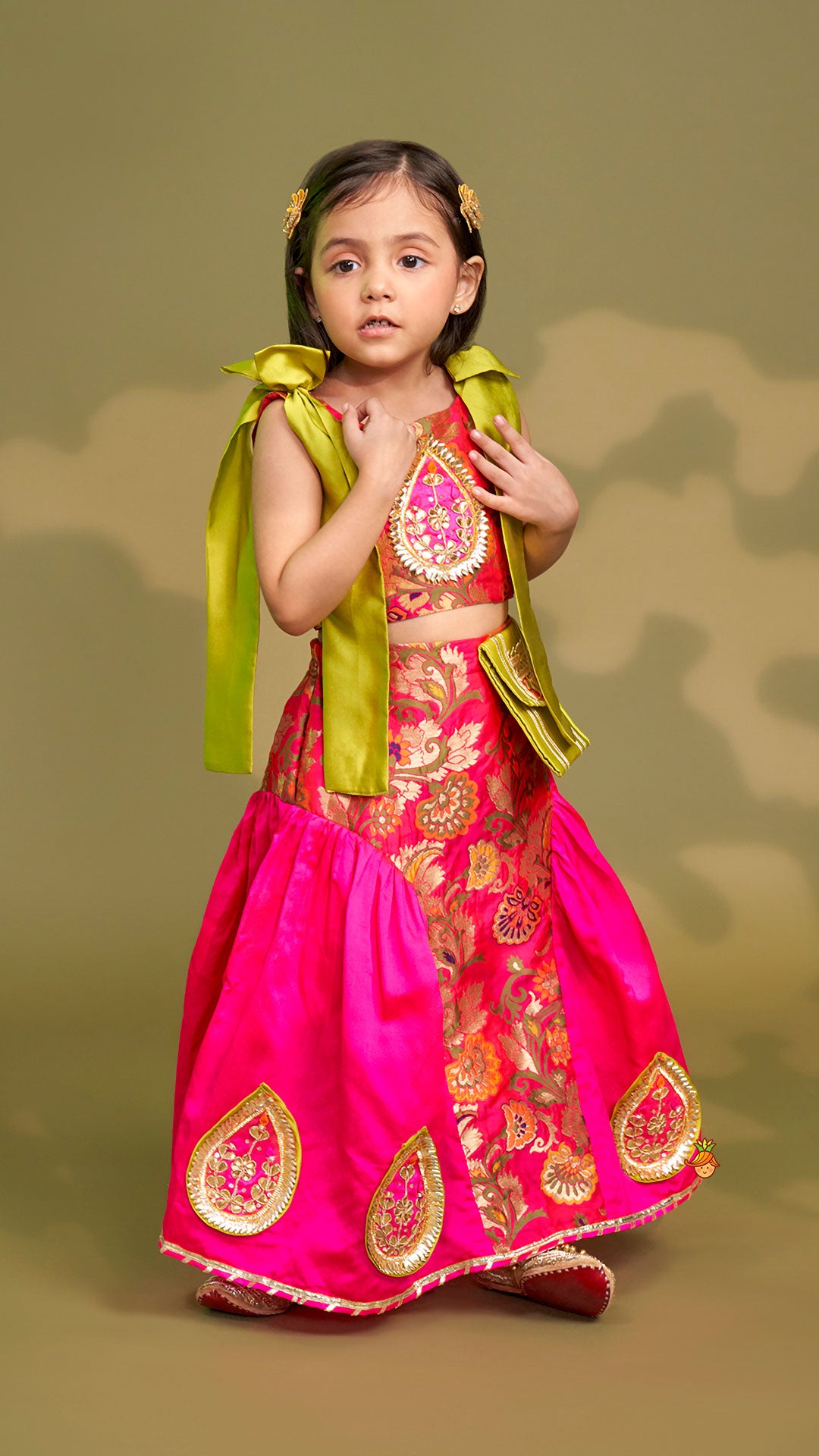 Stunning Bow Embellished Floral Top With Matching Lehenga And Attached Pouch