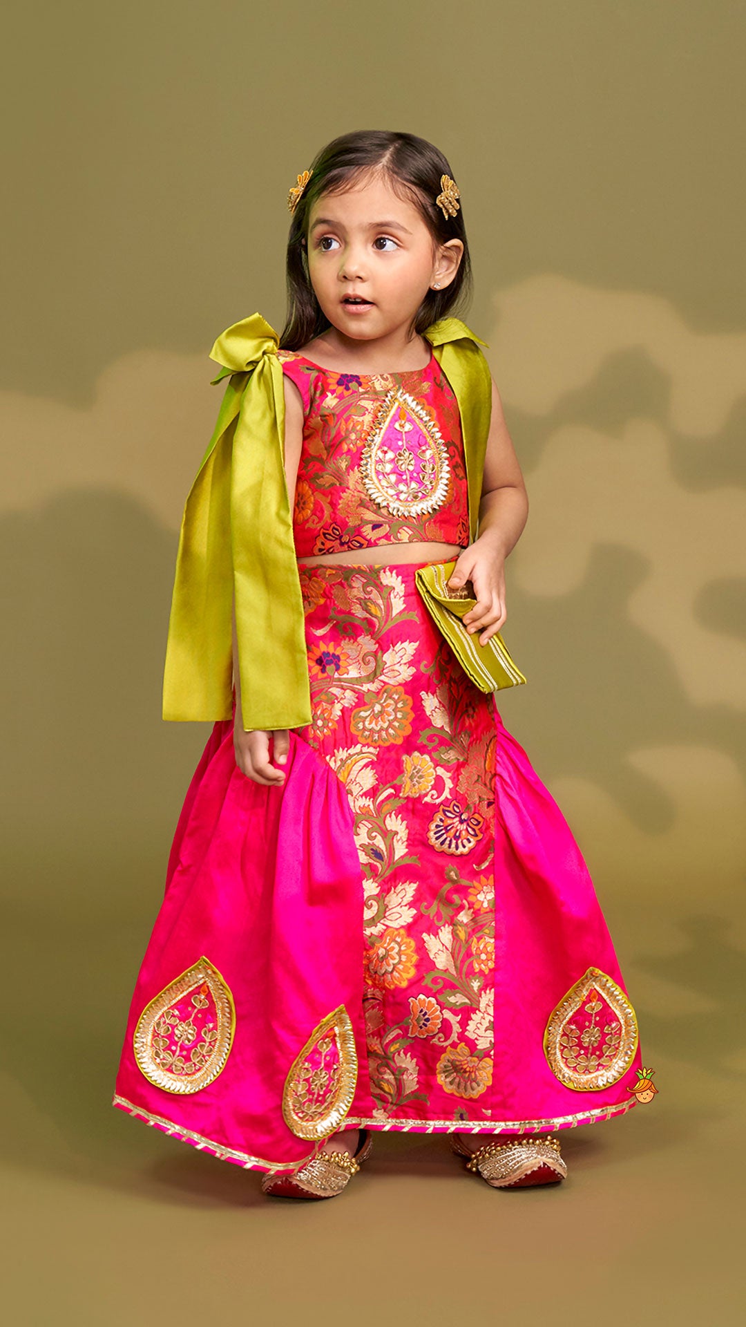 Stunning Bow Embellished Floral Top With Matching Lehenga And Attached Pouch
