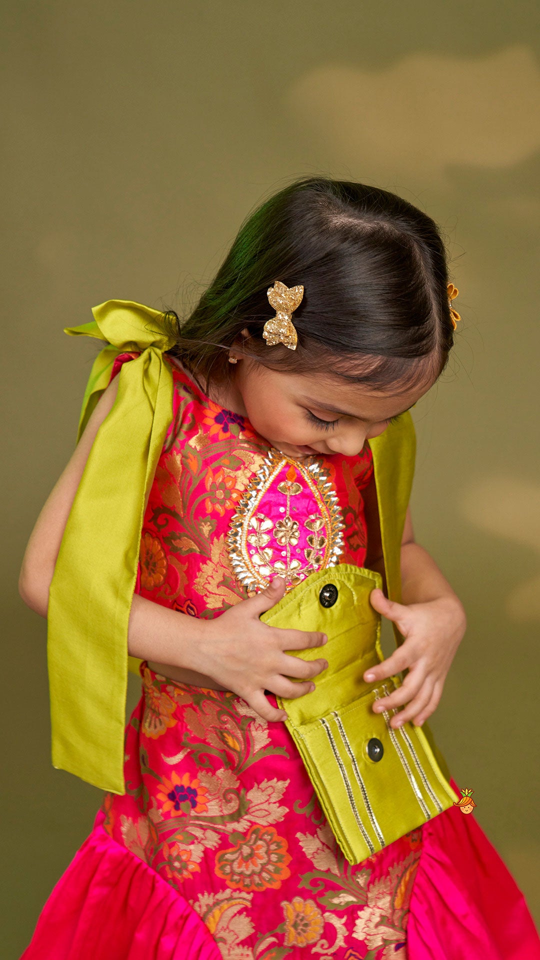 Stunning Bow Embellished Floral Top With Matching Lehenga And Attached Pouch