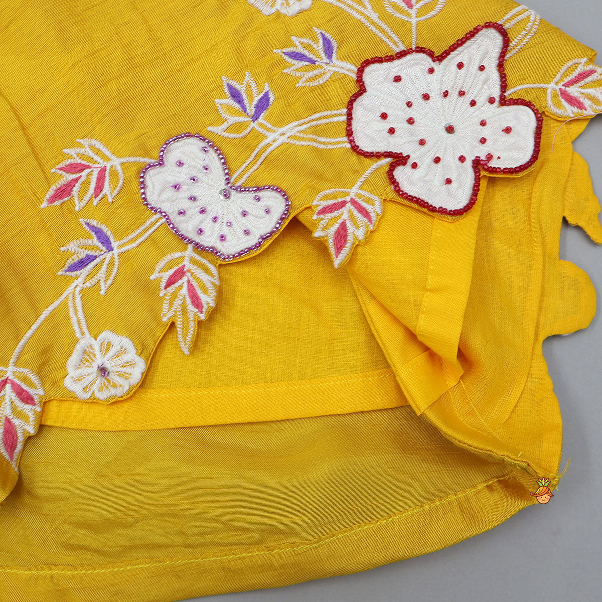 Beautiful Floral Embroidered Sleeveless Kurti With Pant