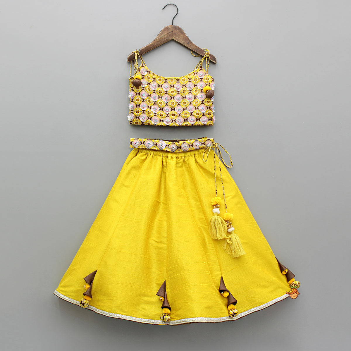 Flowers Adorned Smocked Tie Up Top With Lehenga And Waist Belt