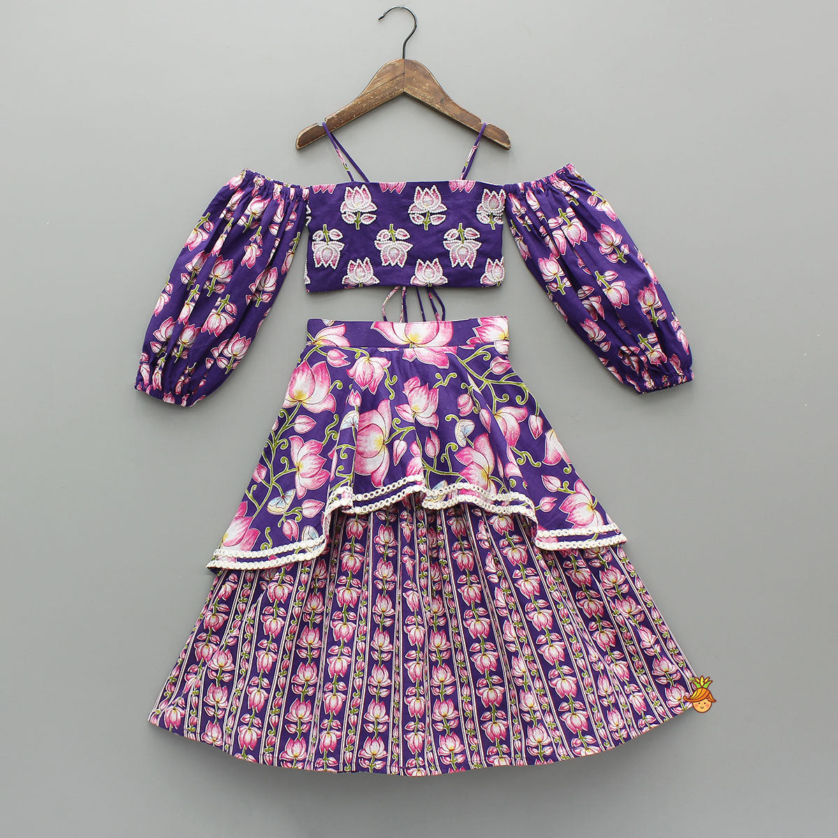 Lotus Embroidered Top And Layered Lehenga With Dupatta And Fringed Potli Bag
